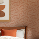 Fern Leaf Wallpaper in Cream on Terracotta